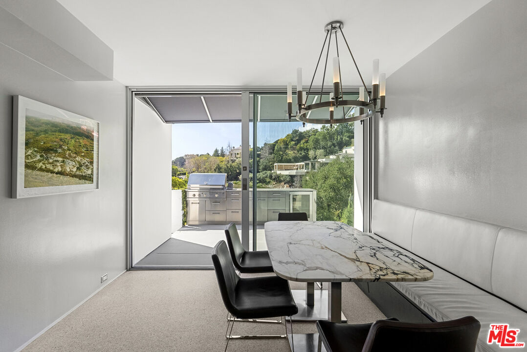 10899 Chalon Road Los Angeles, CA 90077 - Photo 16 of 34 a view of a dining room with furniture window and outside view