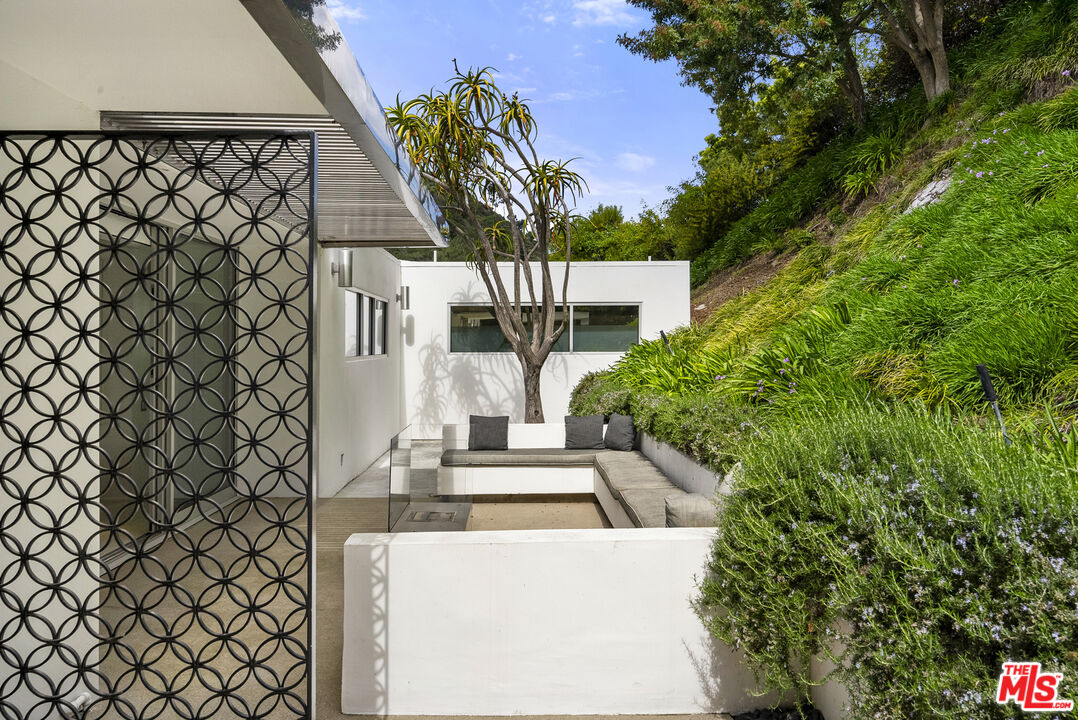 10899 Chalon Road Los Angeles, CA 90077 - Photo 9 of 34 a view of entryway with a house