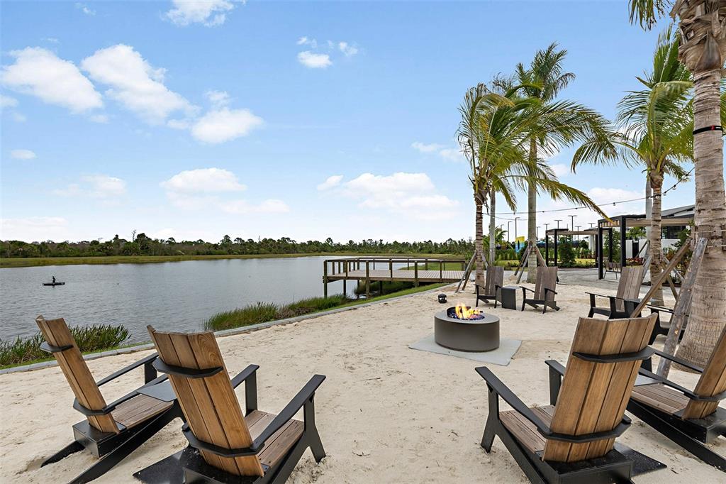 11439 Boundless Terrace Venice, FL 34293 - Photo 35 of 41 a swimming pool with outdoor seating and water view