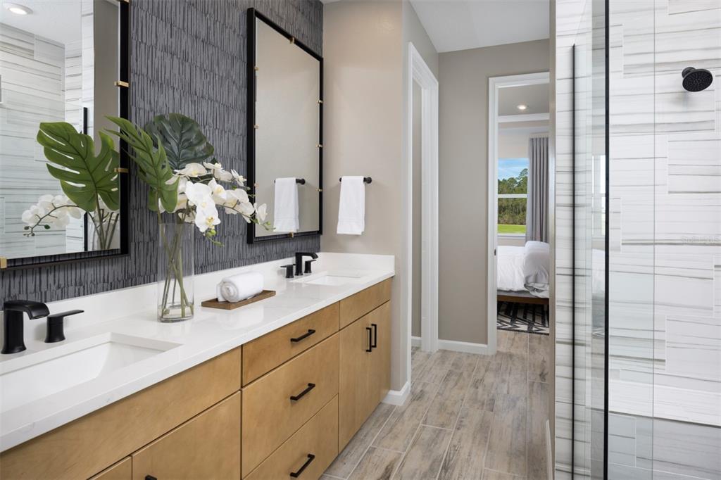 11439 Boundless Terrace Venice, FL 34293 - Photo 9 of 41 a bathroom with a double vanity sink and a mirror