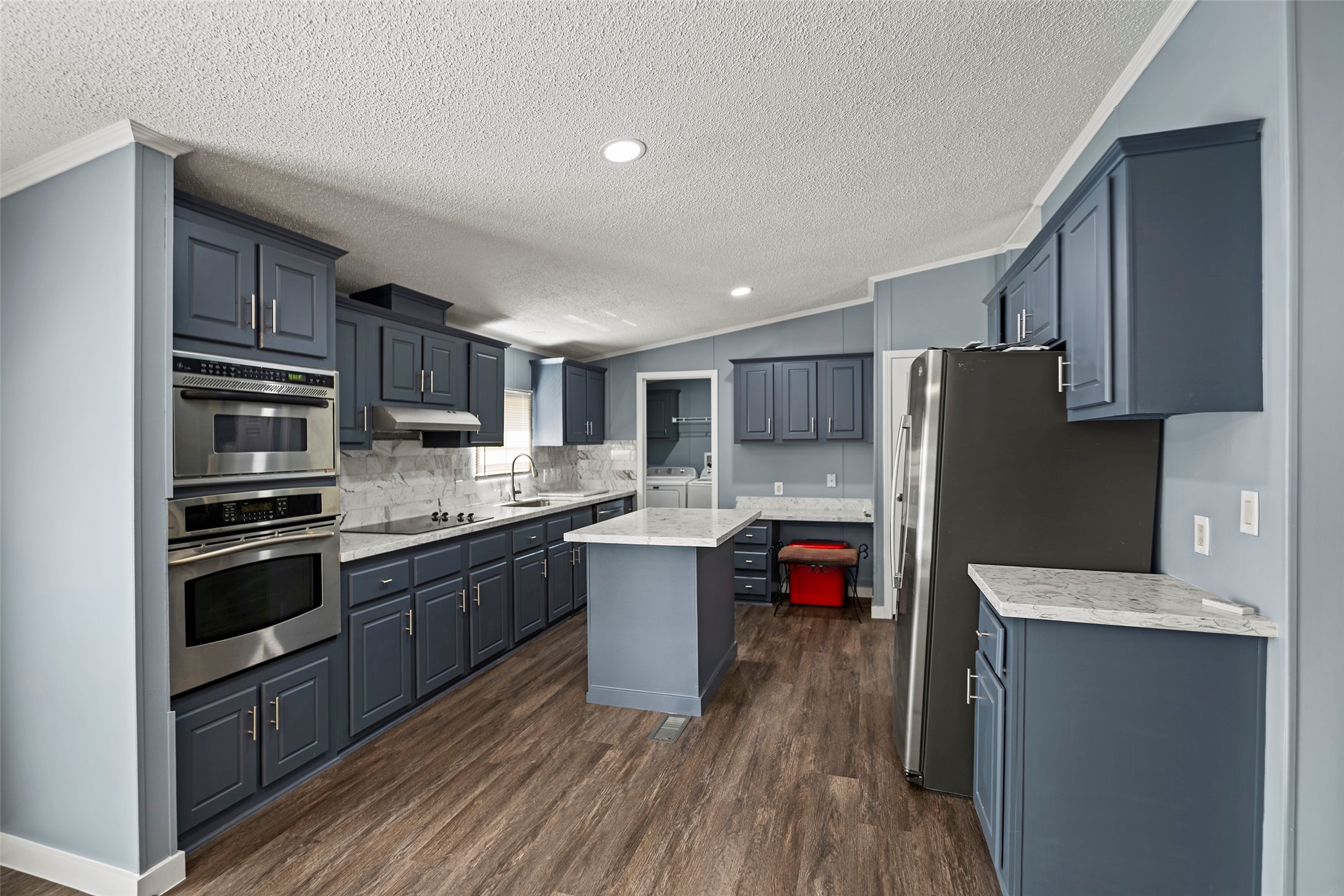 15411 Treichel Road Tomball, TX 77377 - Photo 9 of 24 Remodeled Kitchen witn new stainless steel appliances. Refrigerator is included.