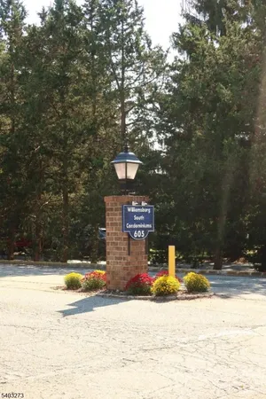 a view of a building with a snow on the road
