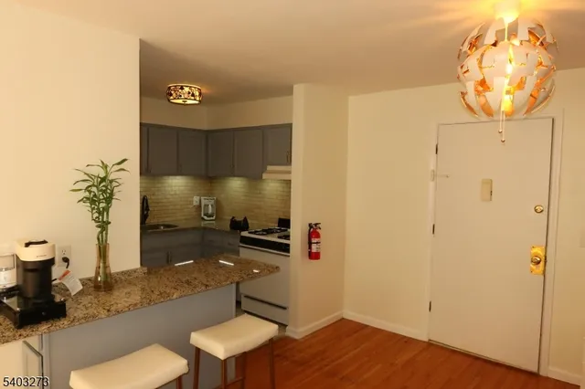 a kitchen with a sink and a stove