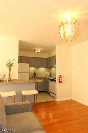 a view of a swimming pool and lounge chair