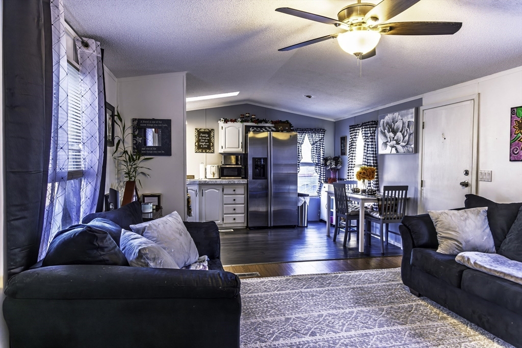 18 Maple Street, Unit 30 Pepperell, MA 01463 - Photo 3 of 19 a living room with furniture and wooden floor