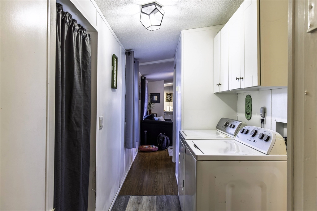 18 Maple Street, Unit 30 Pepperell, MA 01463 - Photo 8 of 19 a kitchen with a refrigerator and a sink