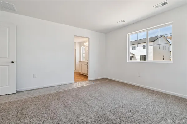 a view of an empty room with a window