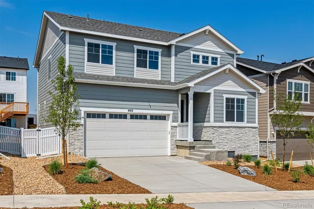 a front view of a house with garage