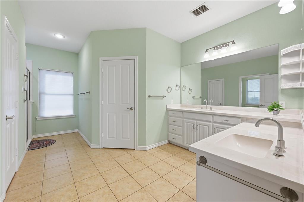 1616 Nash-Howard Road Waxahachie, TX 75165 - Photo 21 of 36 a bathroom with a sink and a mirror