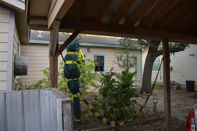 a vase of flowers sitting on a wooden floor