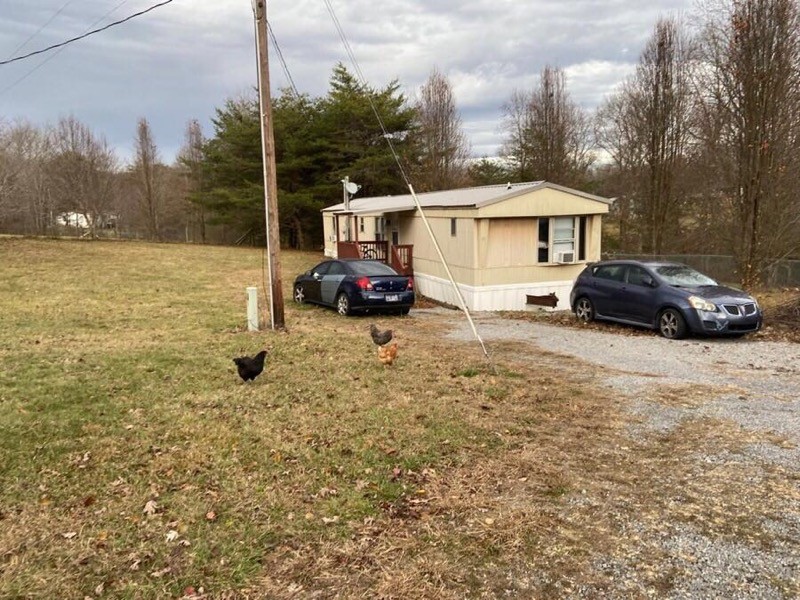 186 Keener Road Dunlap, TN 37327 - Photo 3 of 13 a view of a house with backyard and trees