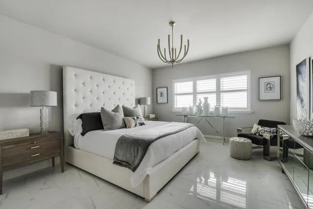 a bedroom with bed and a window