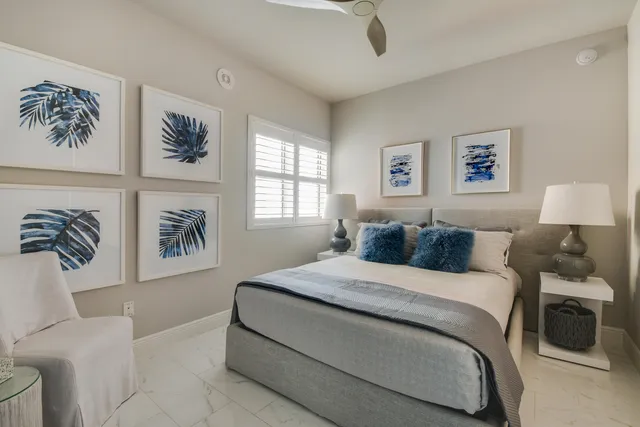 a bedroom with a large bed and a couch