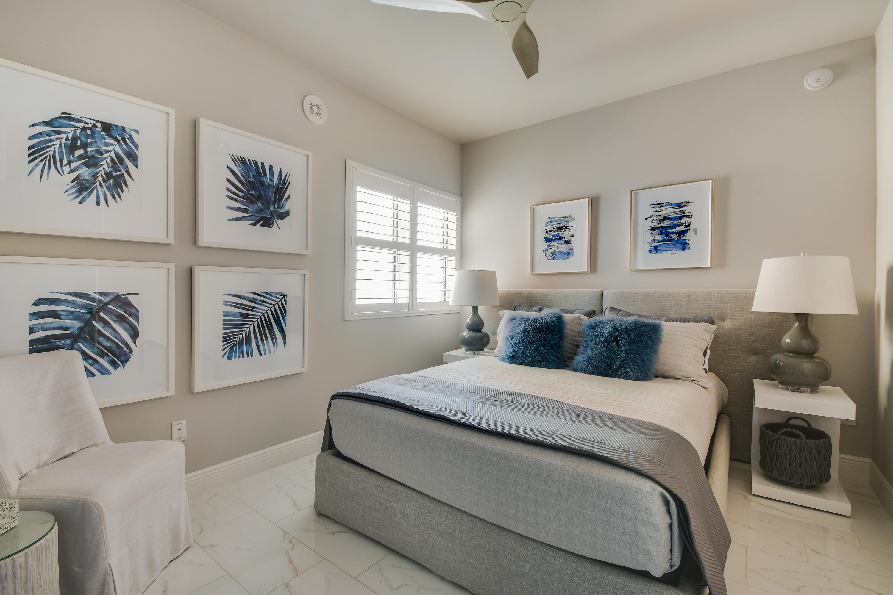 2650 Lake Shore Drive, Unit 1203 Riviera Beach, FL 33404 - Photo 10 of 17 a bedroom with a large bed and a couch