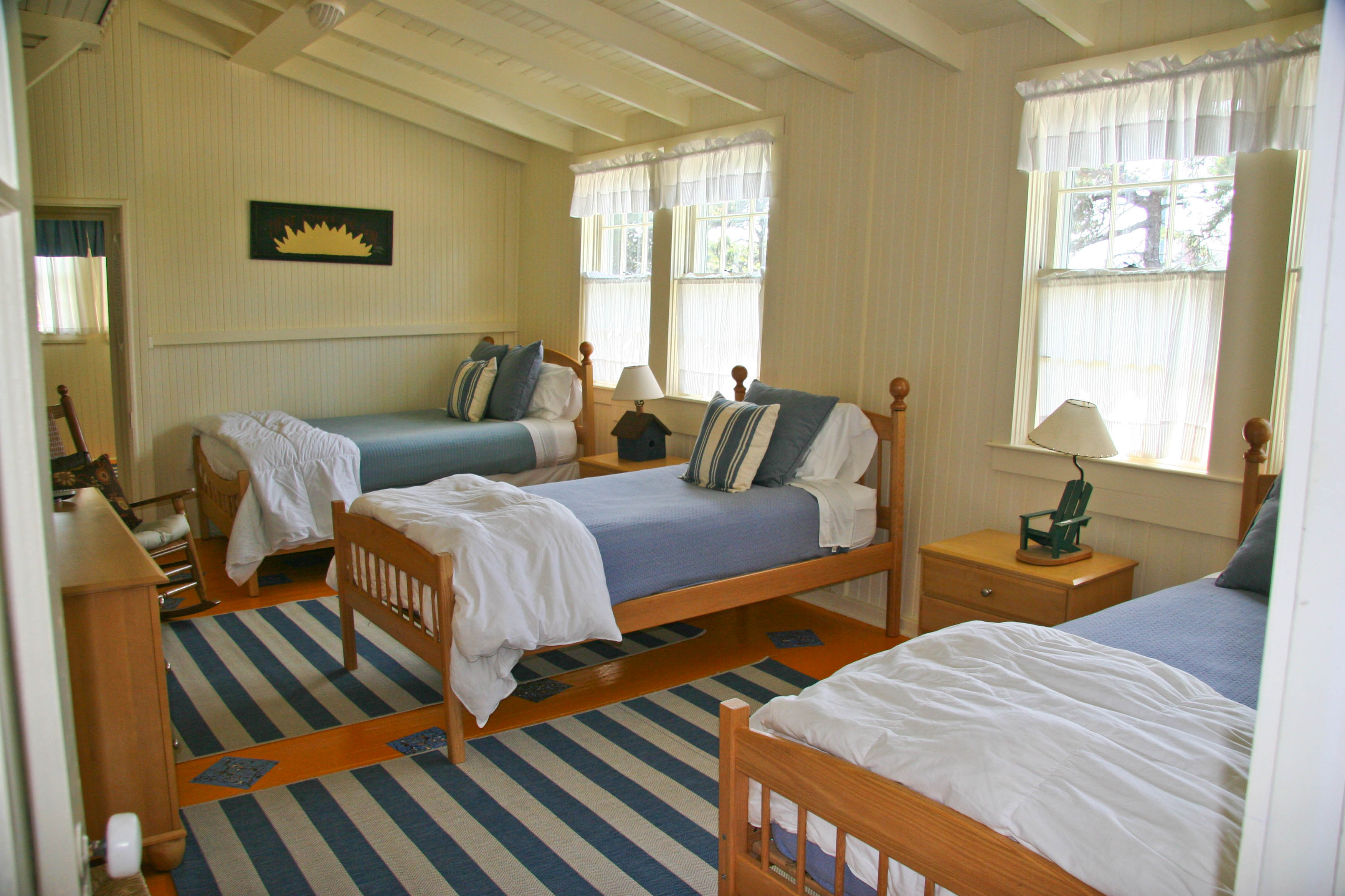 144 Surfside Road Nantucket, MA 02554 - Photo 17 of 46 a bedroom with bed and a window