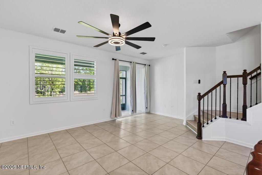 45 Seaport Breeze Road St. Augustine, FL 32095 - Photo 34 of 88 a view of a livingroom with a ceiling fan and window