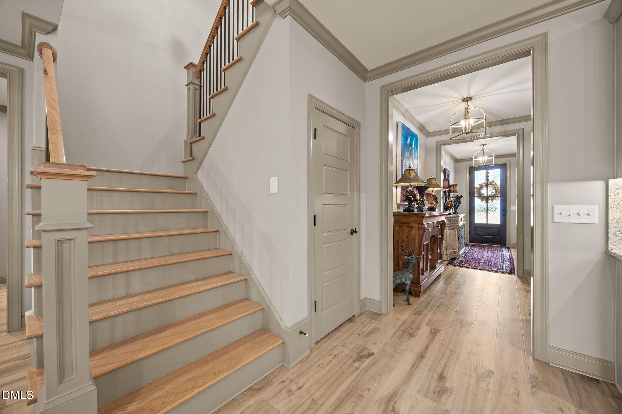 1748 Deacon Fls Way Wendell, NC 27591 - Photo 23 of 51 a view of hallway with wooden floor and stairs