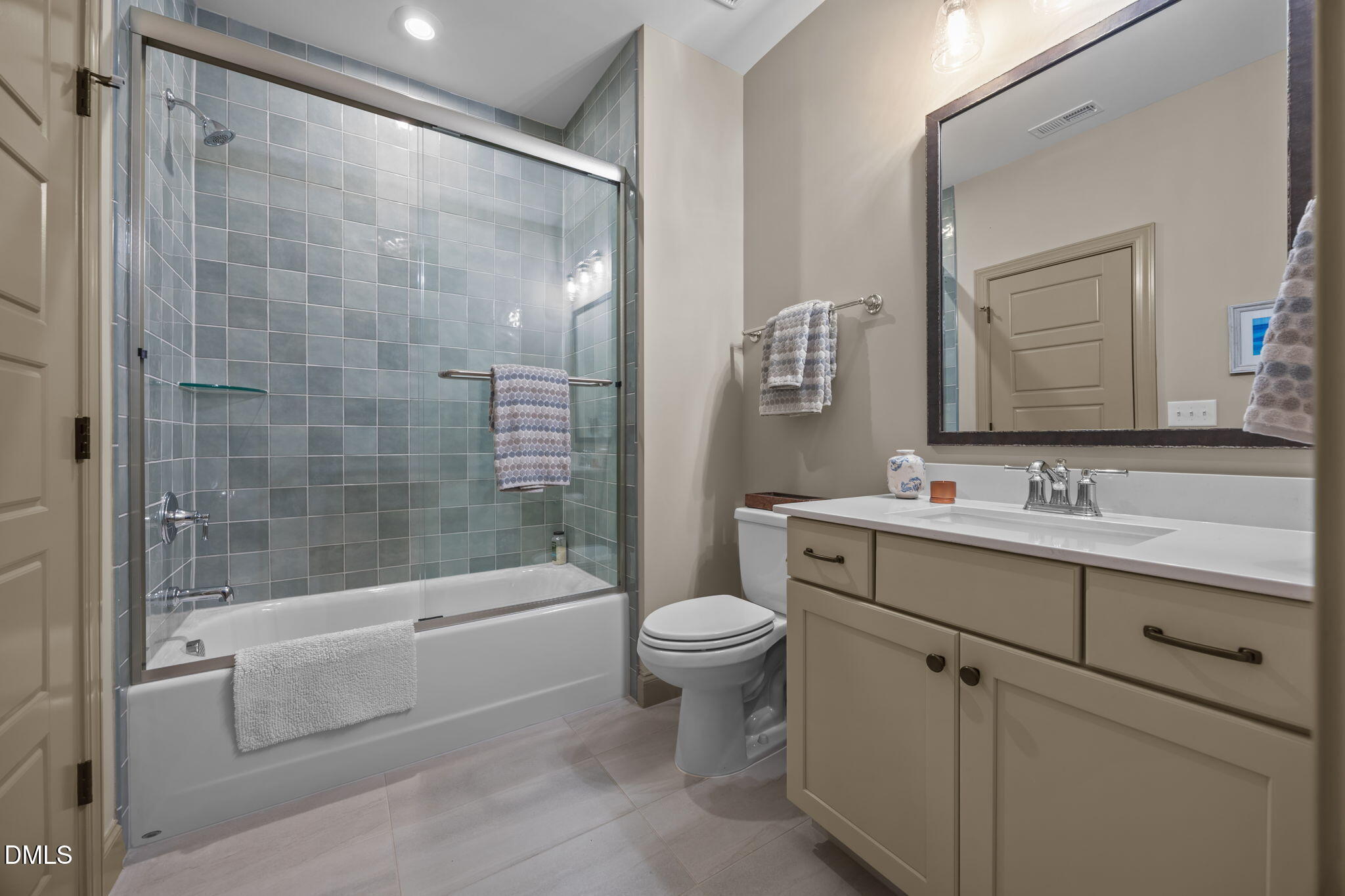 1748 Deacon Fls Way Wendell, NC 27591 - Photo 31 of 51 a bathroom with a bathtub shower sink mirror and toilet
