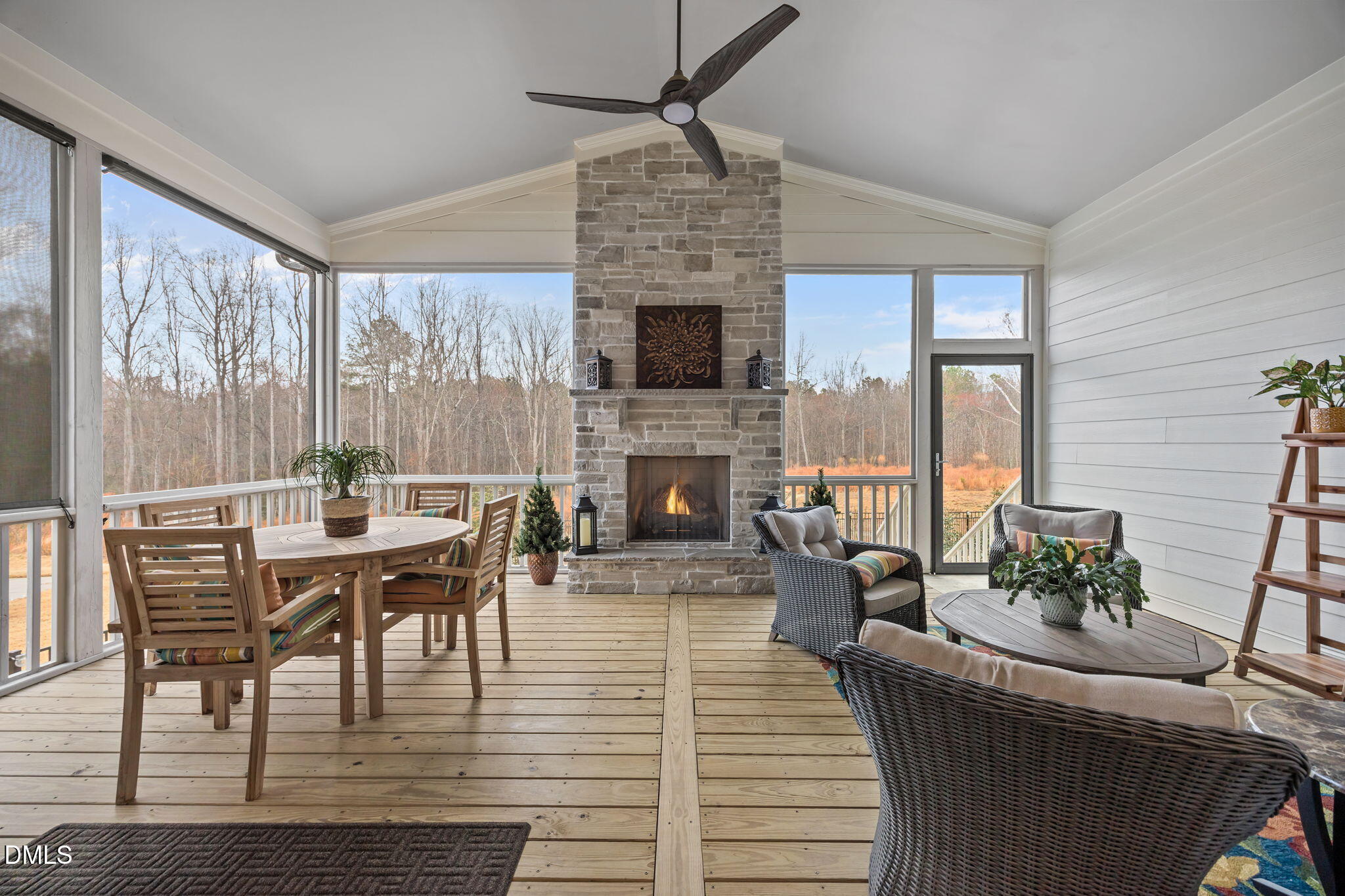 1748 Deacon Fls Way Wendell, NC 27591 - Photo 36 of 51 a living room with furniture a large window and a fireplace