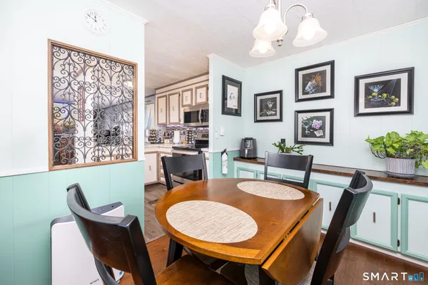a dining room with furniture and window