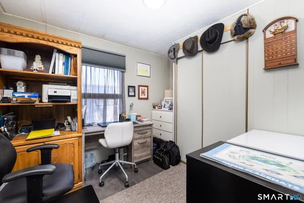 a workspace with furniture and a book shelf
