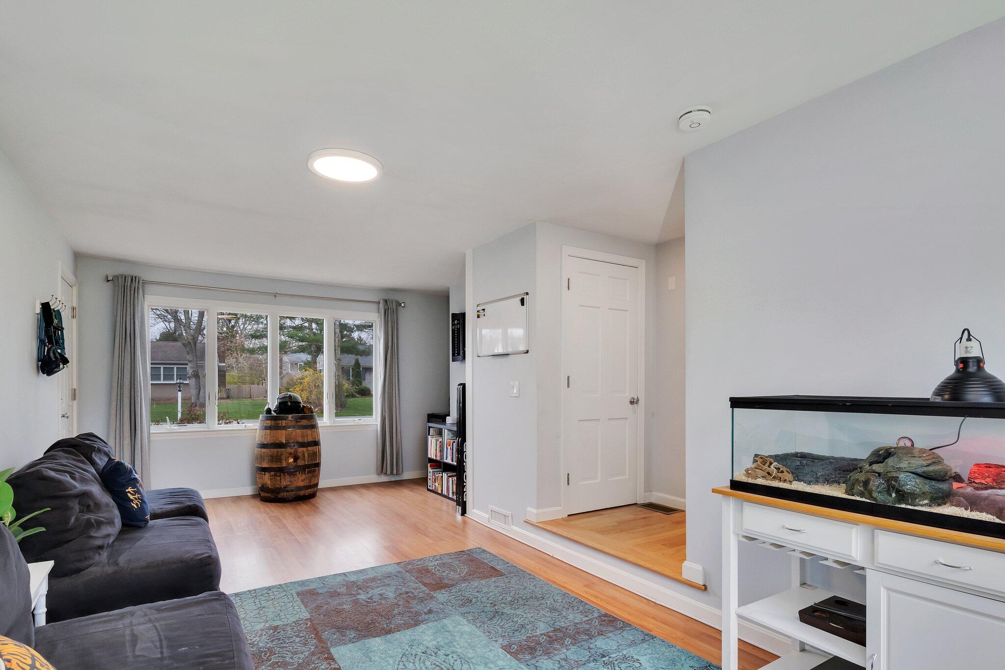 159 Sheaffer Road Centerville, MA 02632 - Photo 16 of 29 a living room with furniture and large windows