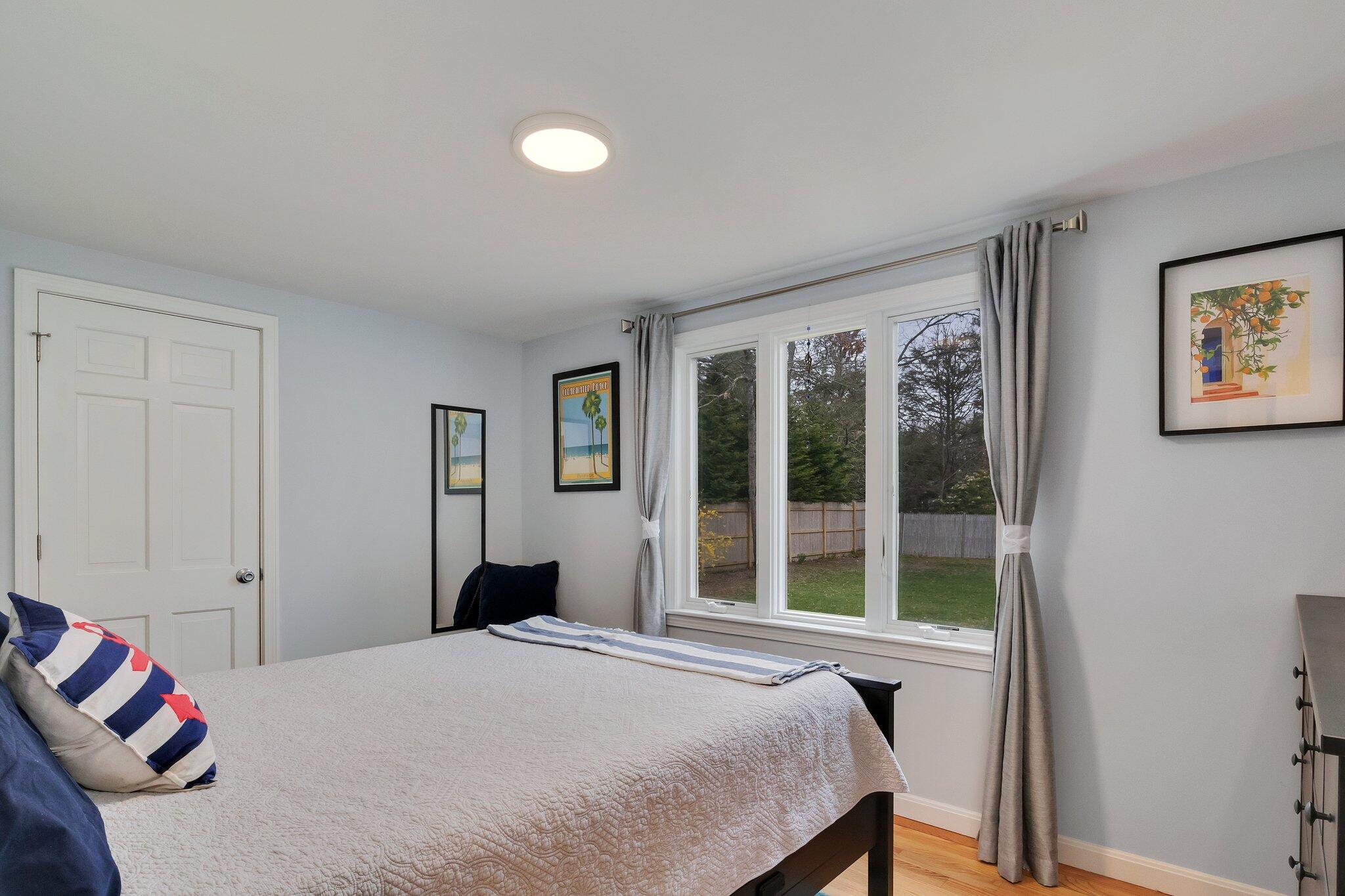 159 Sheaffer Road Centerville, MA 02632 - Photo 17 of 29 a bedroom with a bed and a window