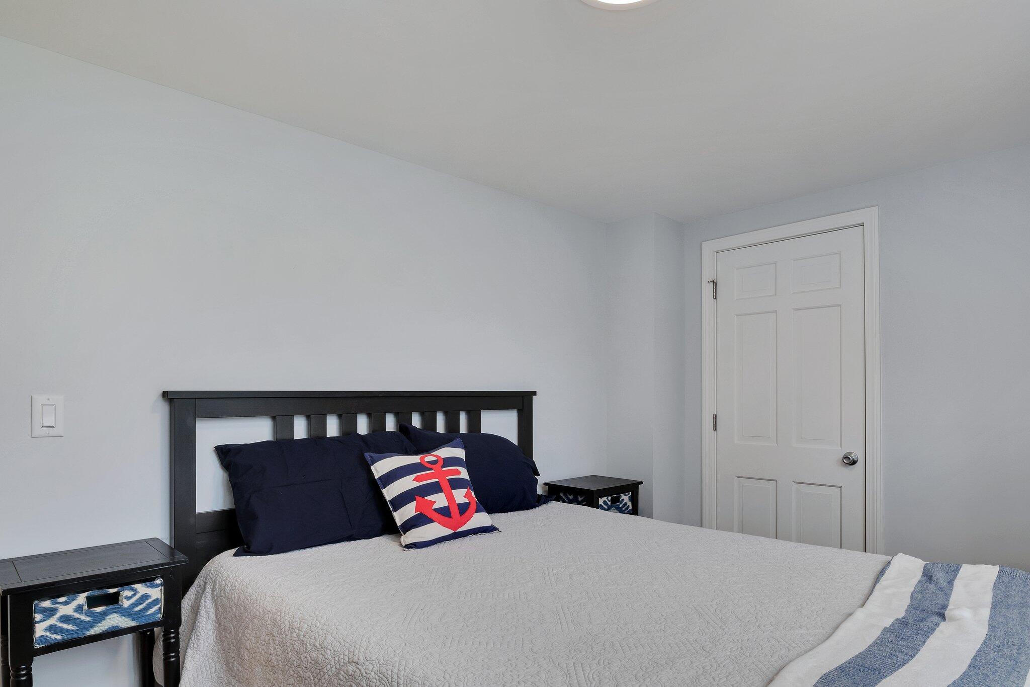 159 Sheaffer Road Centerville, MA 02632 - Photo 18 of 29 a bedroom with a bed and a night stand