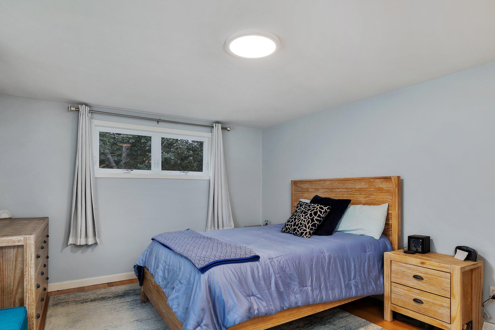 159 Sheaffer Road Centerville, MA 02632 - Photo 21 of 29 a bedroom with a bed and wooden floor