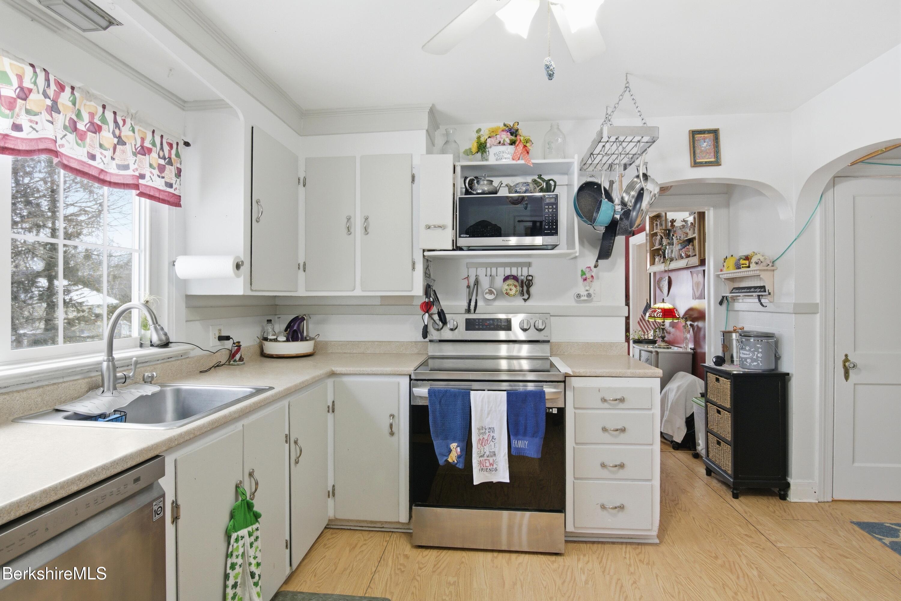 53 Edison Avenue Pittsfield, MA 01201 - Photo 14 of 45 a kitchen with stainless steel appliances granite countertop a sink and a stove