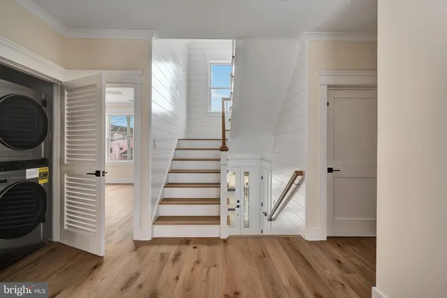 a view of entryway with wooden floor