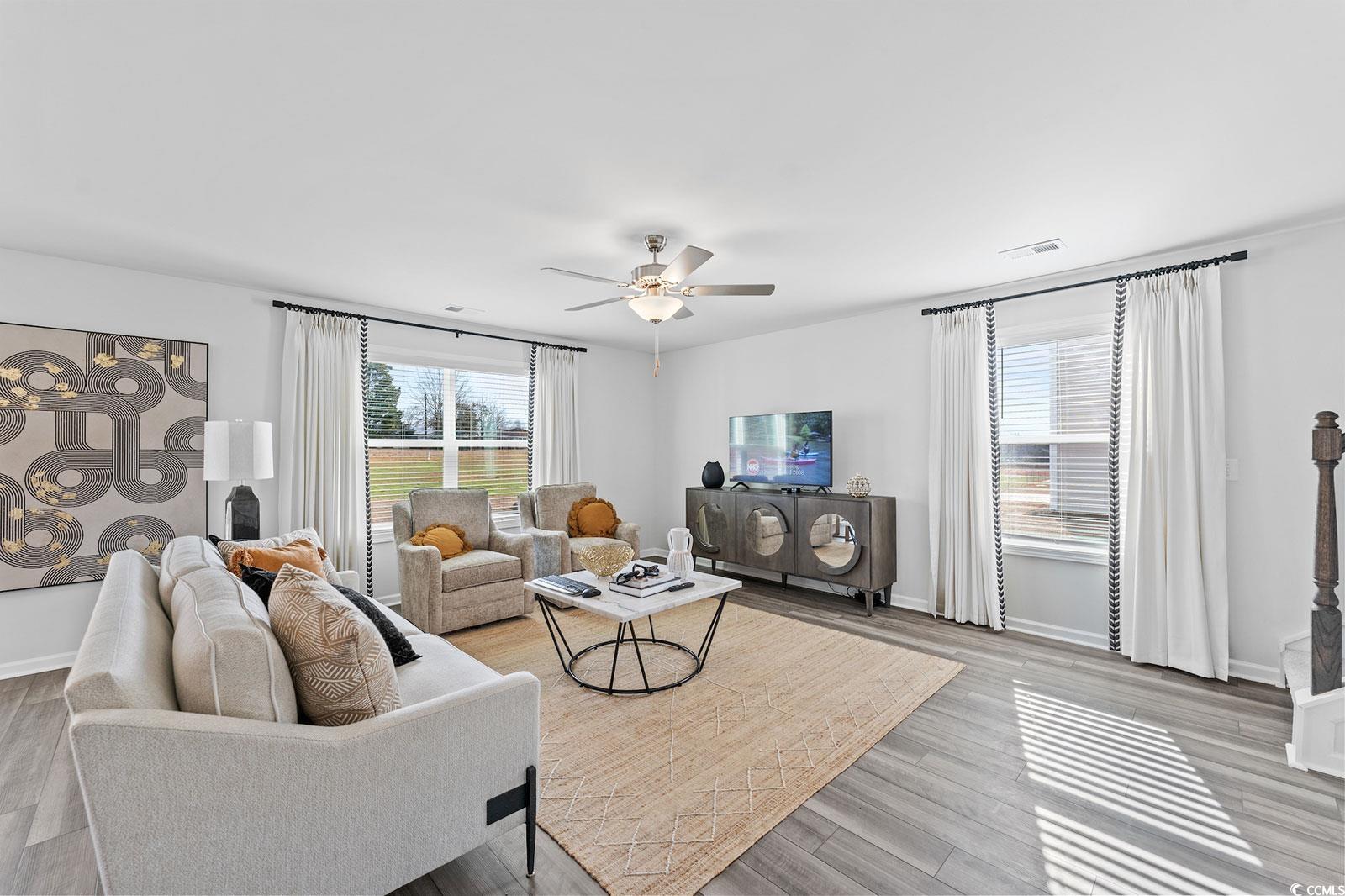 211 Sundrop Way Conway, SC 29526 - Photo 4 of 10 Living area featuring light wood finished floors and ceiling fan