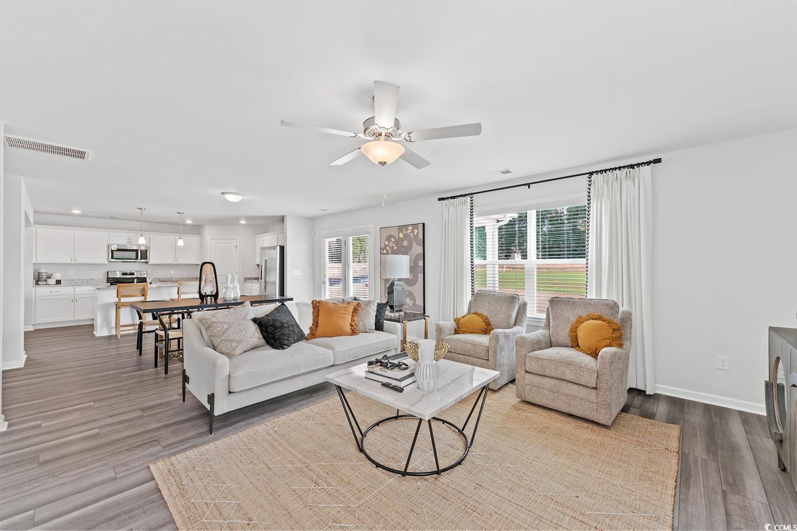 211 Sundrop Way Conway, SC 29526 - Photo 6 of 10 Living room with light wood finished floors and a ceiling fan