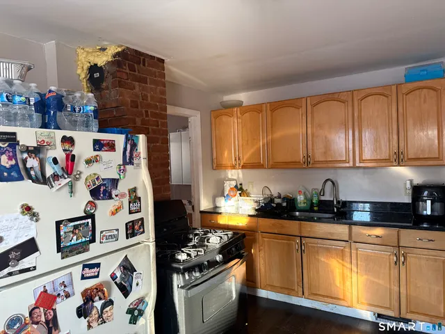 a kitchen with stainless steel appliances and cabinets