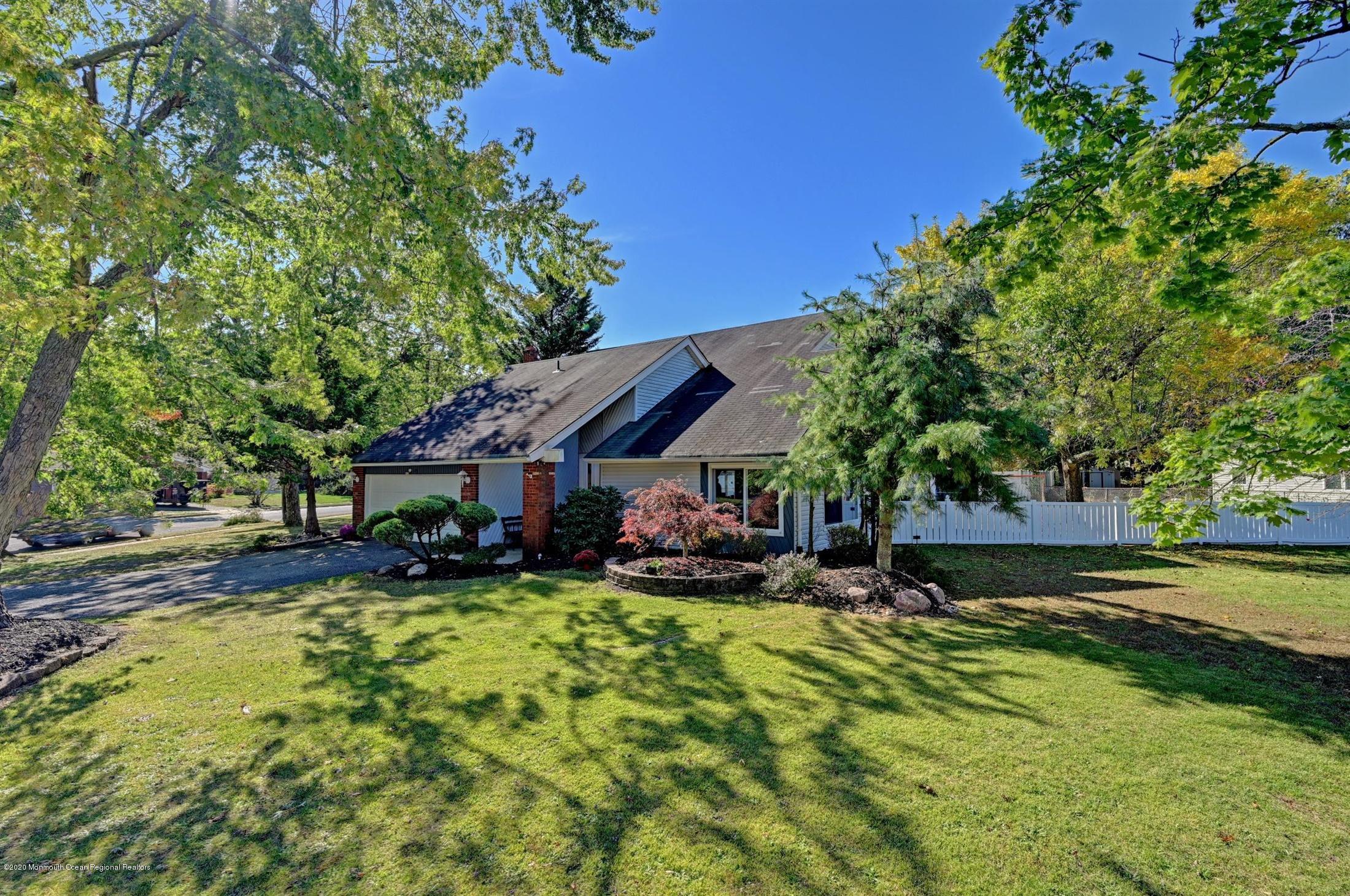 27 Sugar Bush Road Howell, NJ 07731 - Photo 1 of 46 a view of a house with swimming pool and sitting area