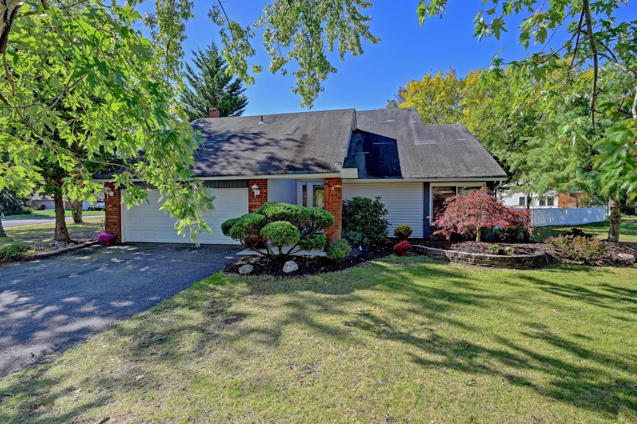 27 Sugar Bush Road Howell, NJ 07731 - Photo 2 of 46 a view of a house with garden and a tree