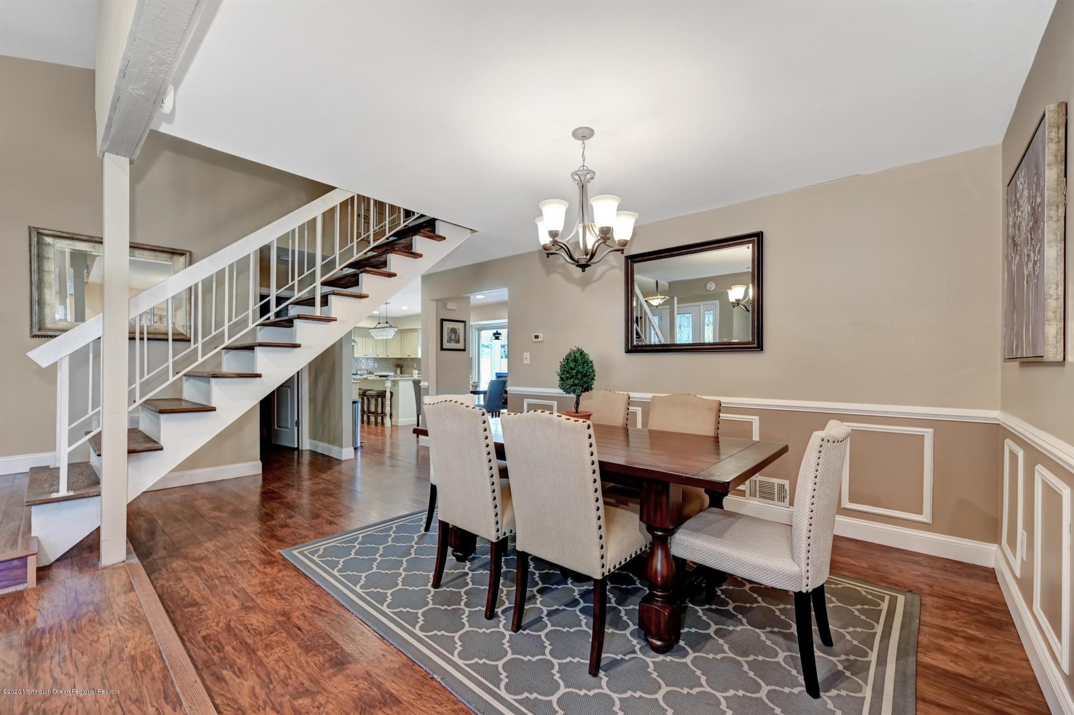 27 Sugar Bush Road Howell, NJ 07731 - Photo 11 of 46 a view of a dining room with furniture a chandelier and wooden floor