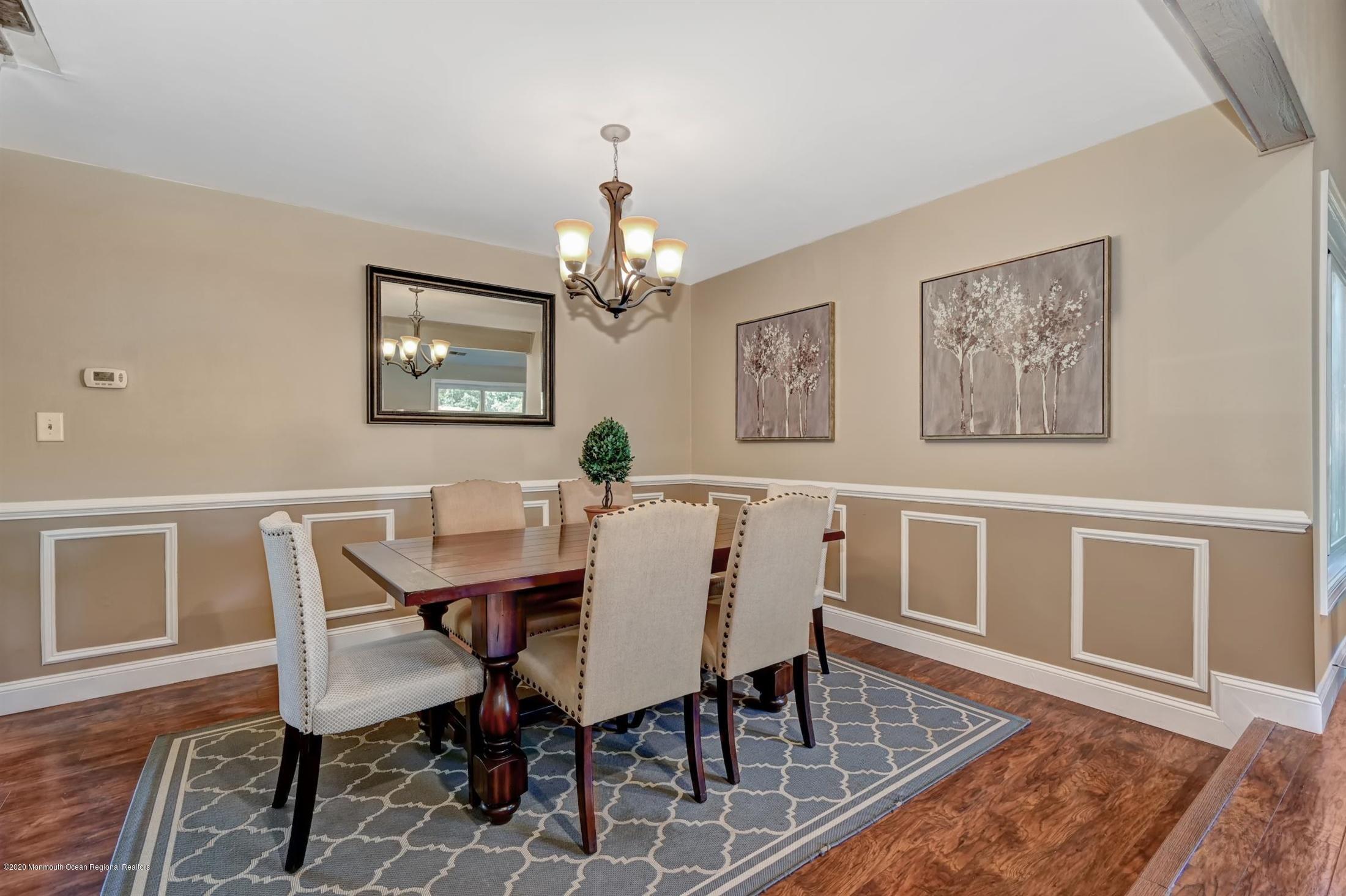 27 Sugar Bush Road Howell, NJ 07731 - Photo 12 of 46 a view of a dining room with furniture and wooden floor