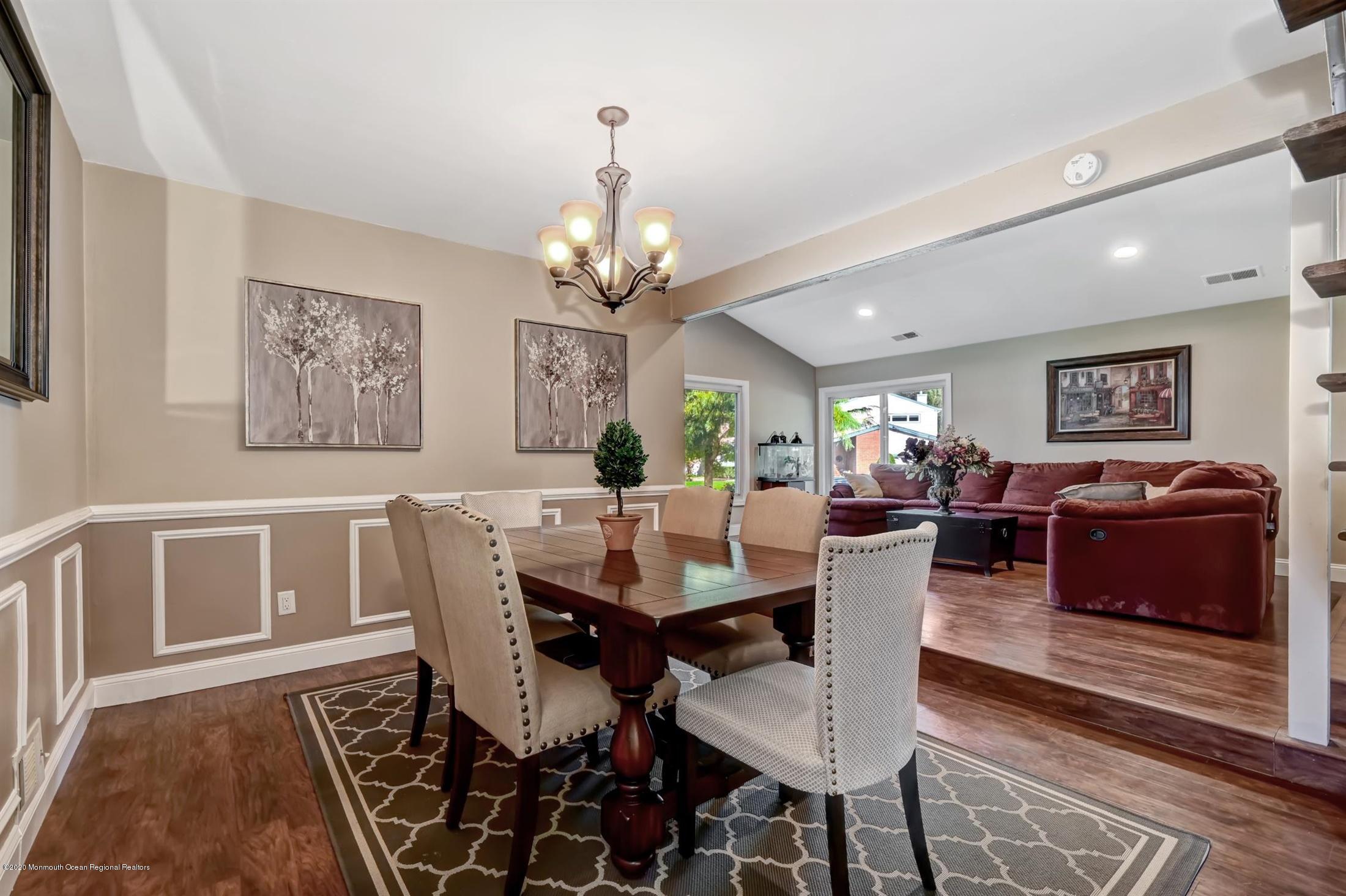 27 Sugar Bush Road Howell, NJ 07731 - Photo 13 of 46 a view of a dining room with furniture a rug and wooden floor