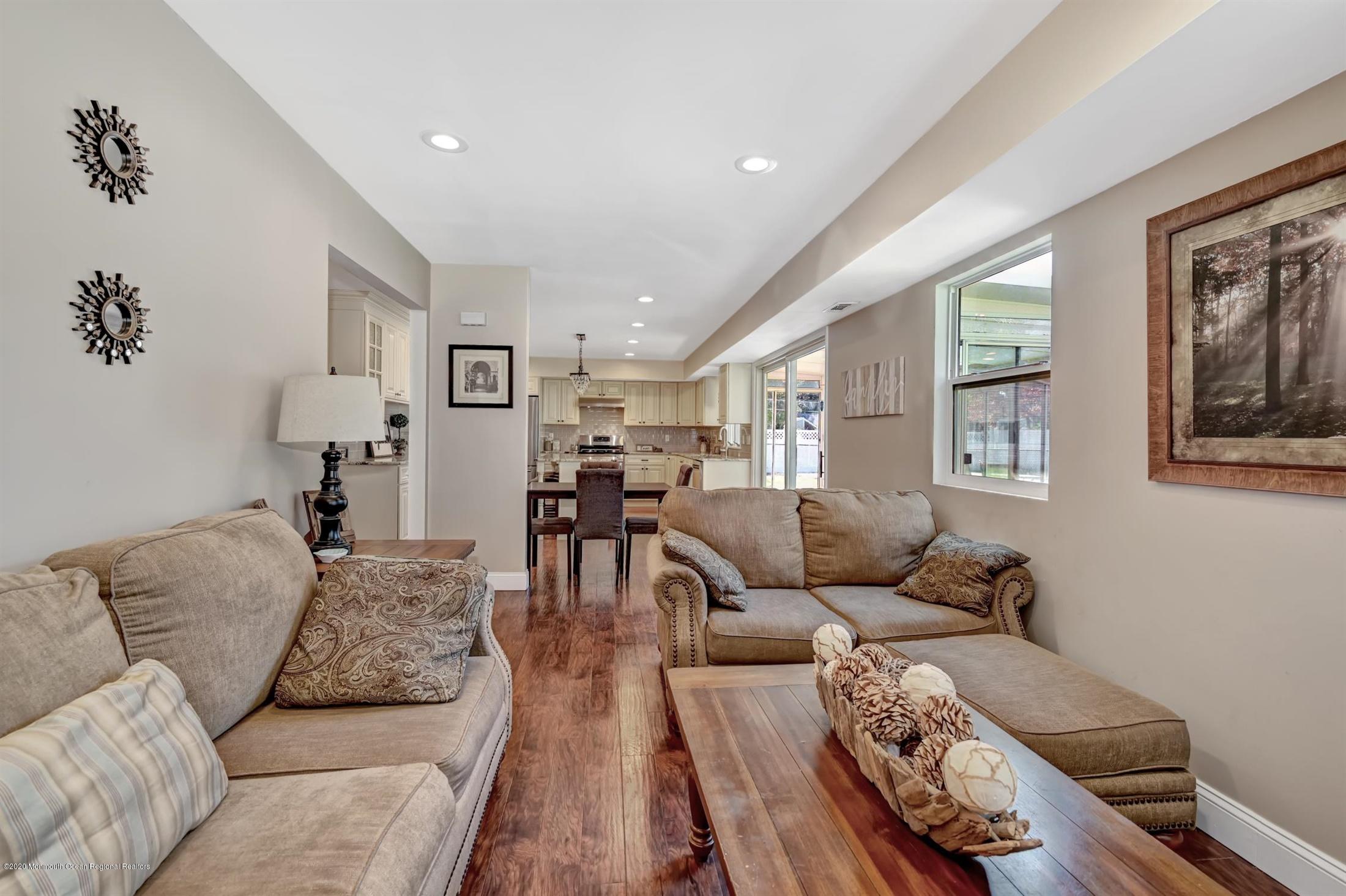 27 Sugar Bush Road Howell, NJ 07731 - Photo 24 of 46 a living room with furniture and wooden floor