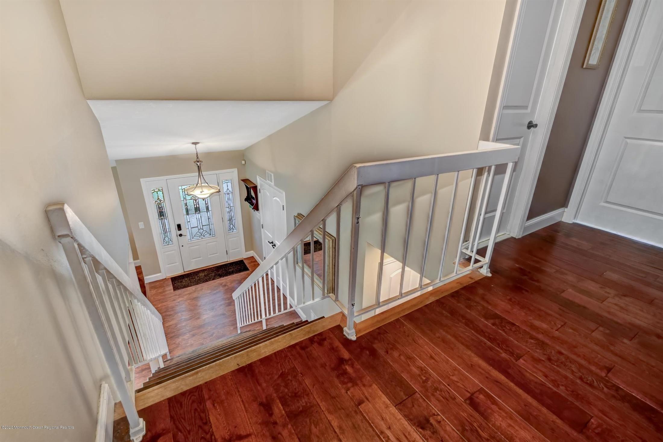 27 Sugar Bush Road Howell, NJ 07731 - Photo 25 of 46 a view of stairs and with wooden floor
