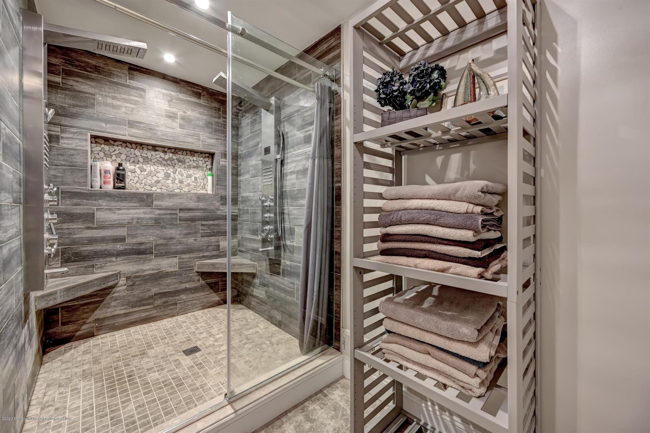 27 Sugar Bush Road Howell, NJ 07731 - Photo 29 of 46 a bathroom with a shower and a mirror
