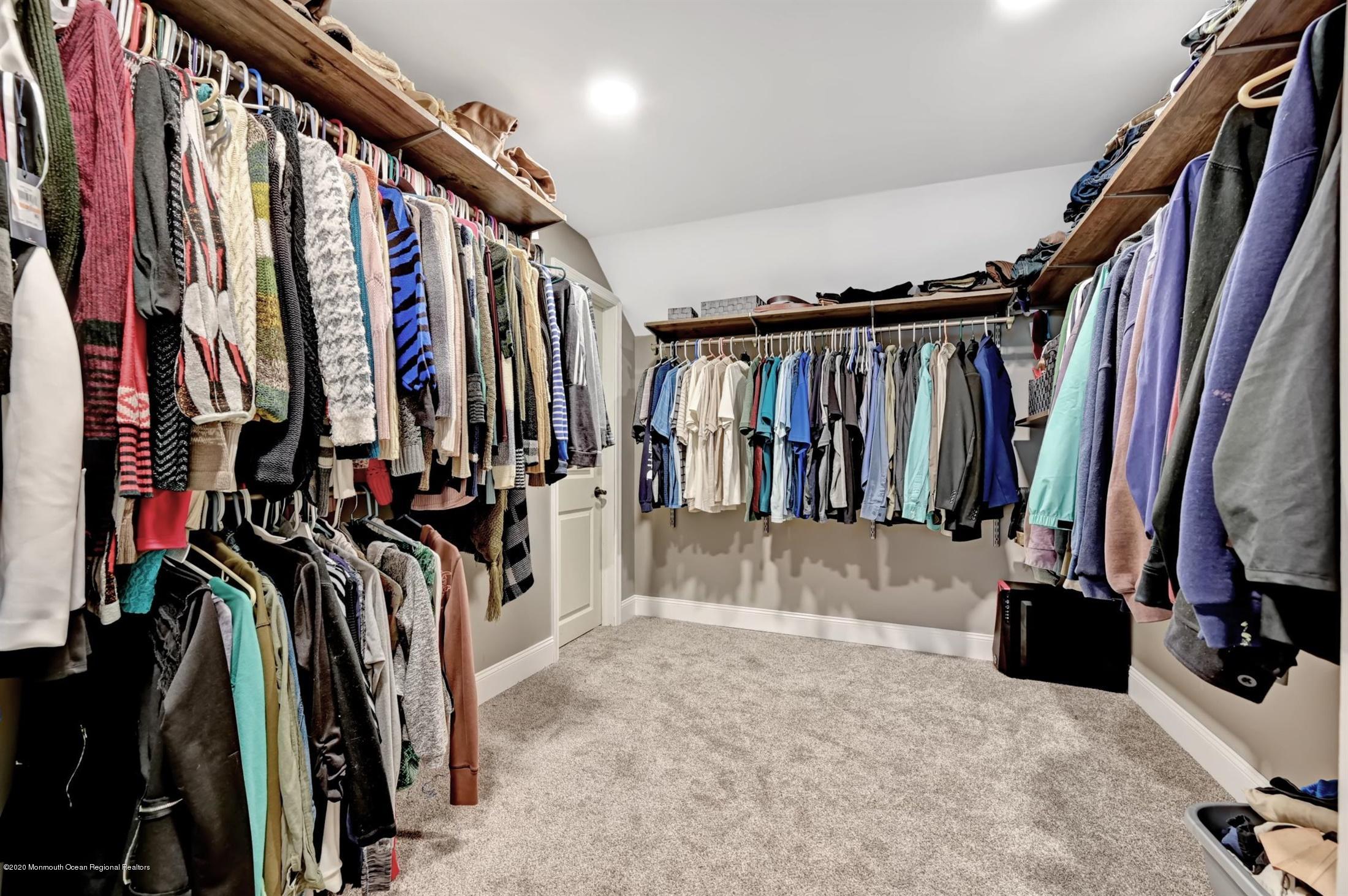 27 Sugar Bush Road Howell, NJ 07731 - Photo 30 of 46 a view of walk in closet with clothes and shoes