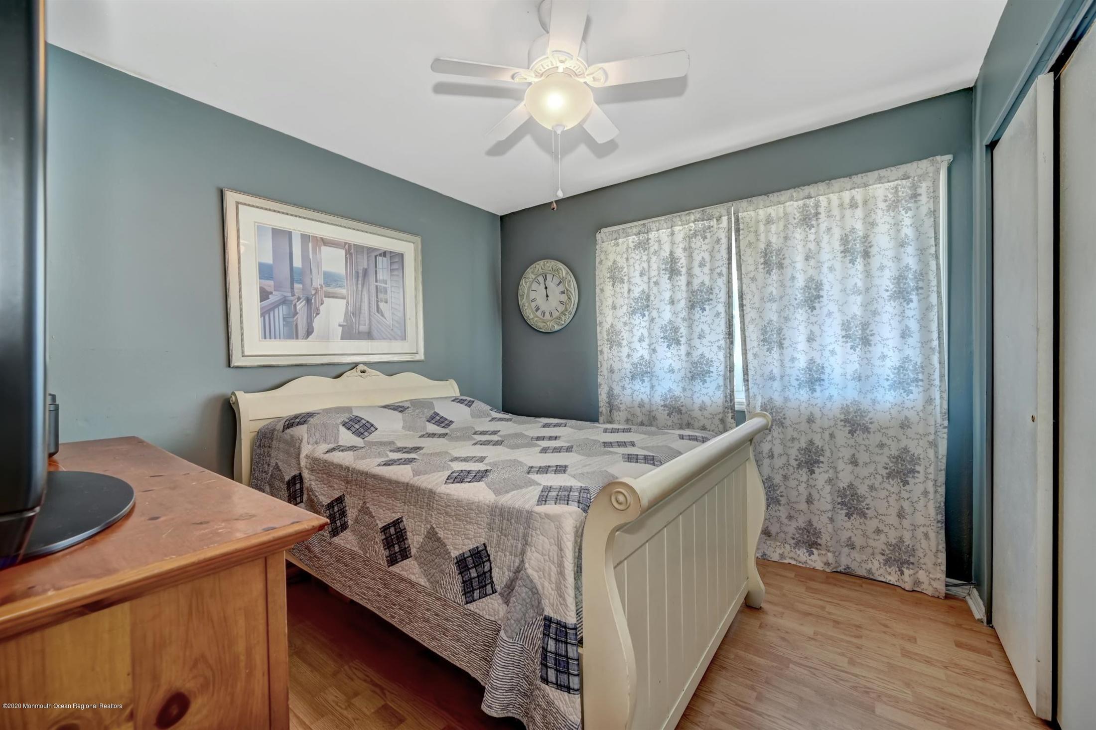 27 Sugar Bush Road Howell, NJ 07731 - Photo 31 of 46 a bedroom with a bed and a table