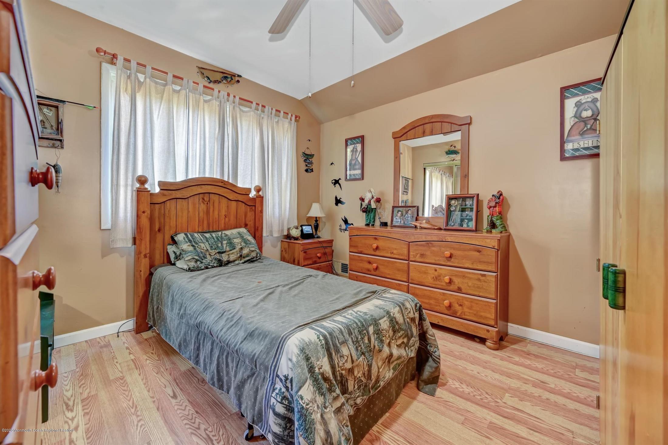 27 Sugar Bush Road Howell, NJ 07731 - Photo 33 of 46 a bedroom with a bed and a dresser