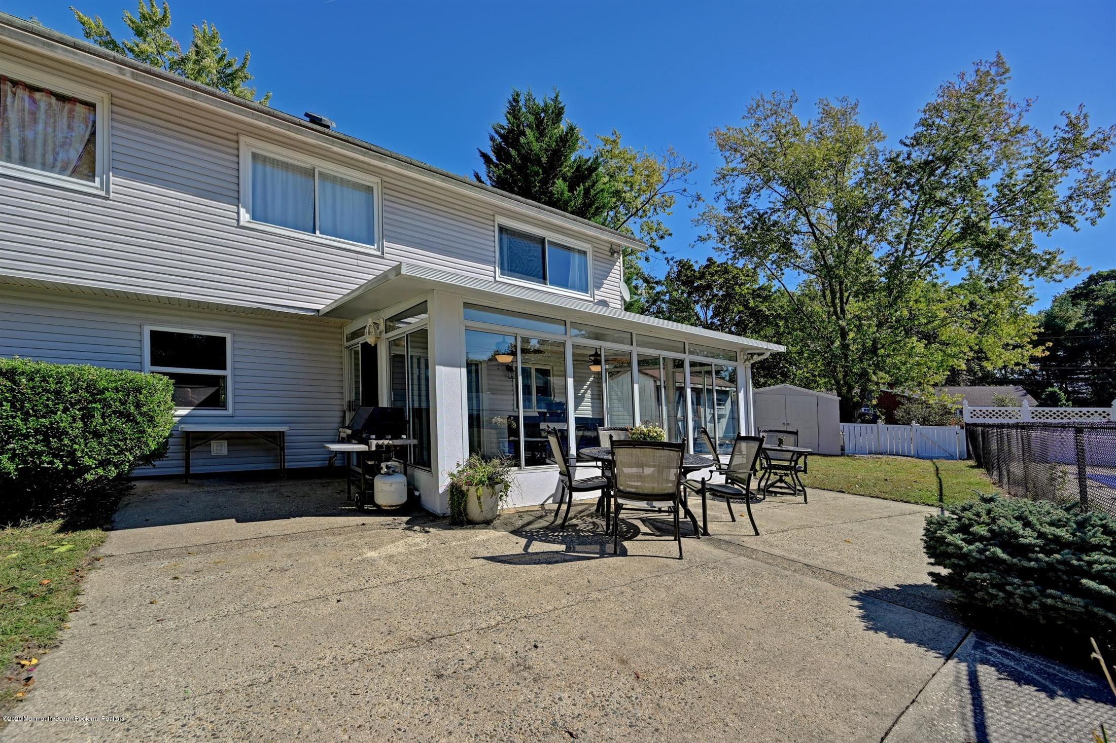 27 Sugar Bush Road Howell, NJ 07731 - Photo 39 of 46 a view of a house with sitting area and garden
