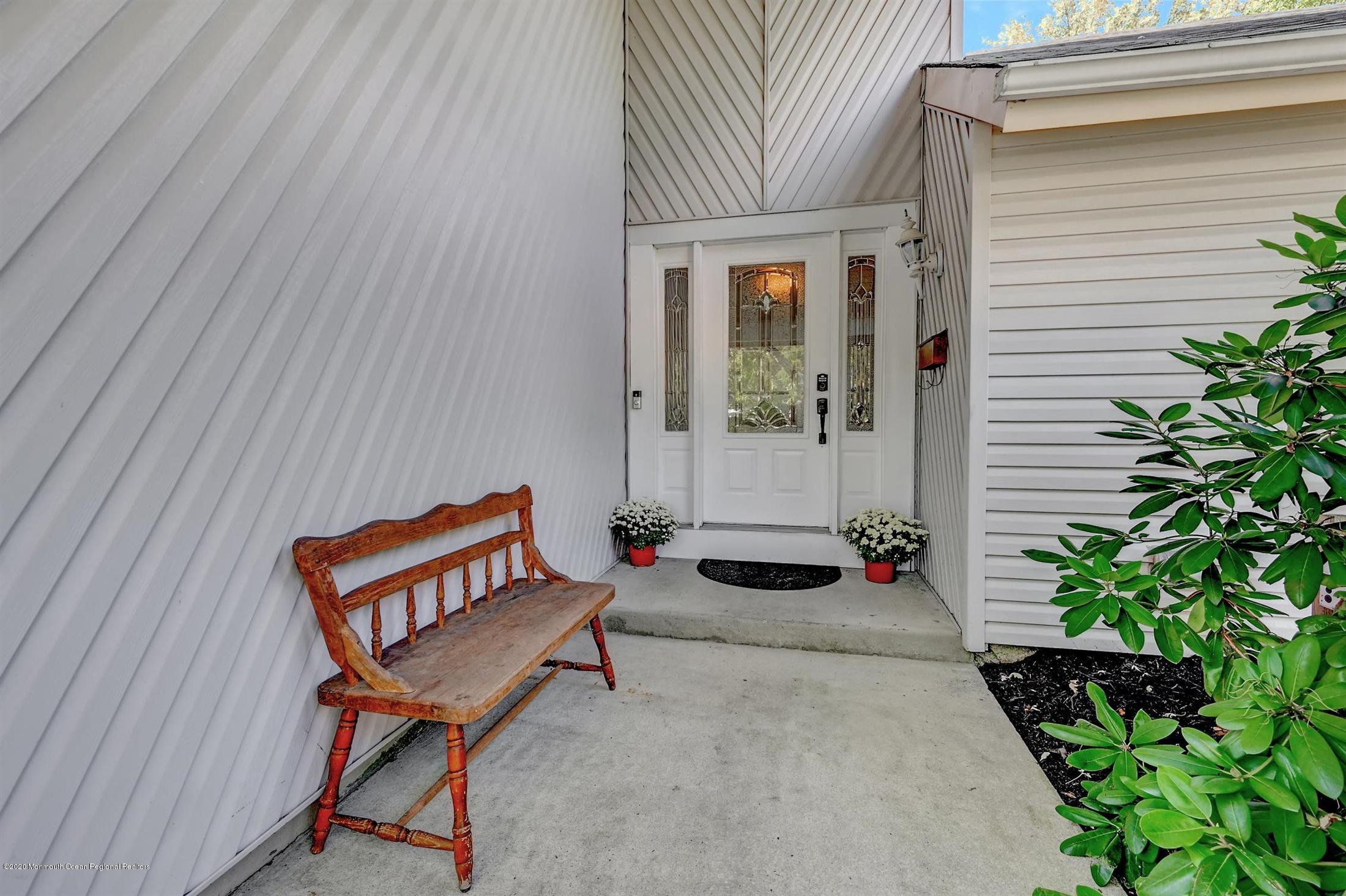 27 Sugar Bush Road Howell, NJ 07731 - Photo 5 of 46 a backyard of a house with seating space