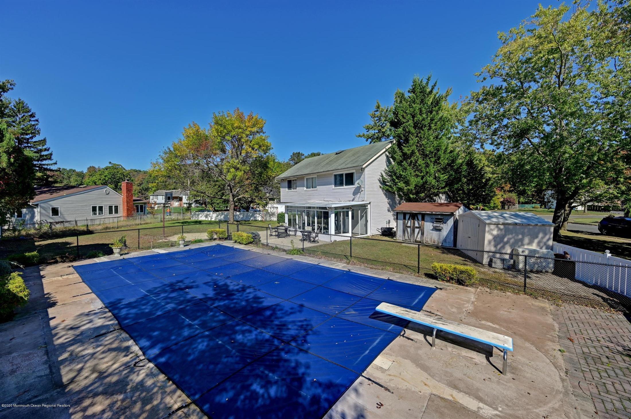 27 Sugar Bush Road Howell, NJ 07731 - Photo 44 of 46 a view of a house with swimming pool
