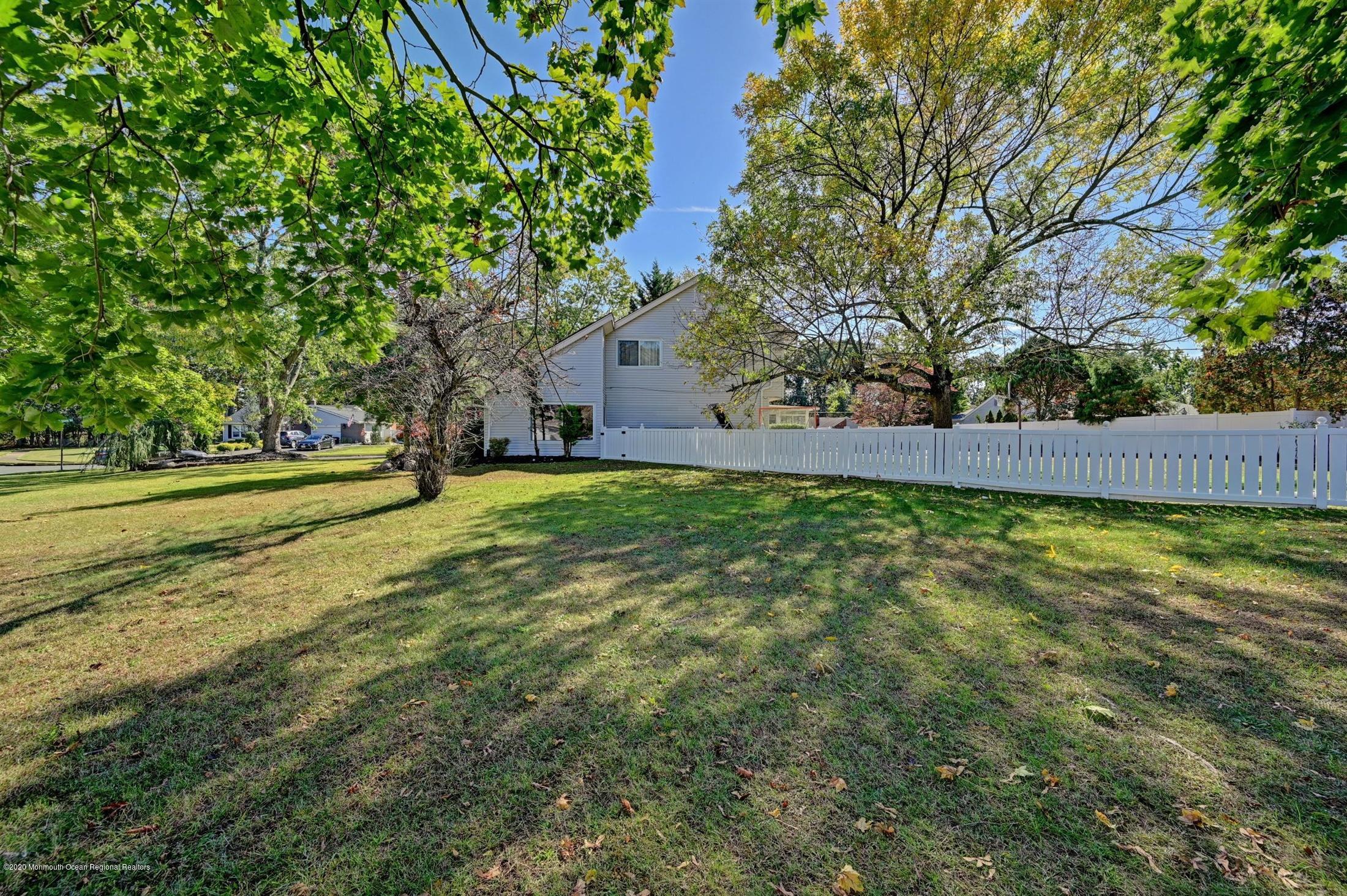27 Sugar Bush Road Howell, NJ 07731 - Photo 46 of 46 a view of a yard with a large tree