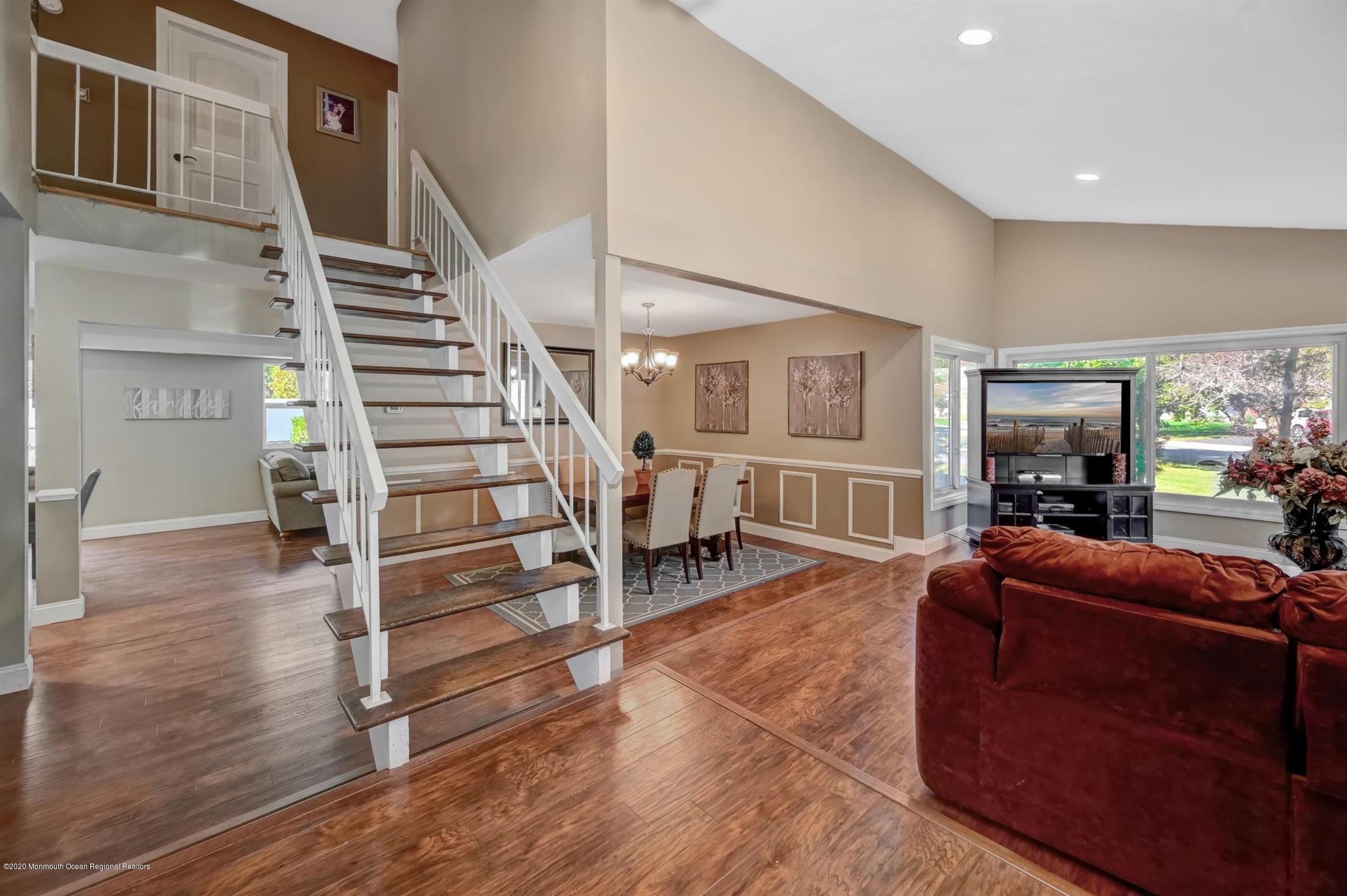 27 Sugar Bush Road Howell, NJ 07731 - Photo 7 of 46 a living room with furniture and a wooden floor